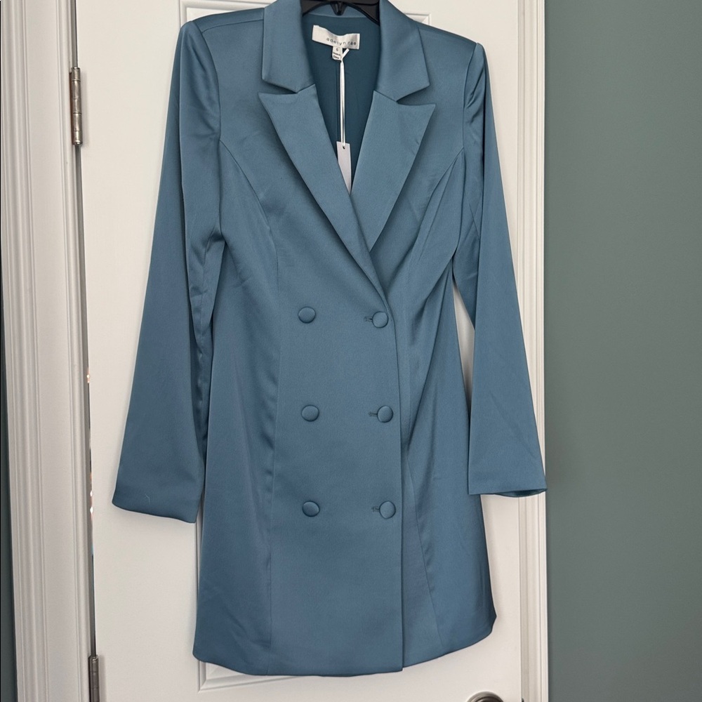 Madelyn Rae Blue Double-Breasted Blazer Dress.
Polyester and lined.